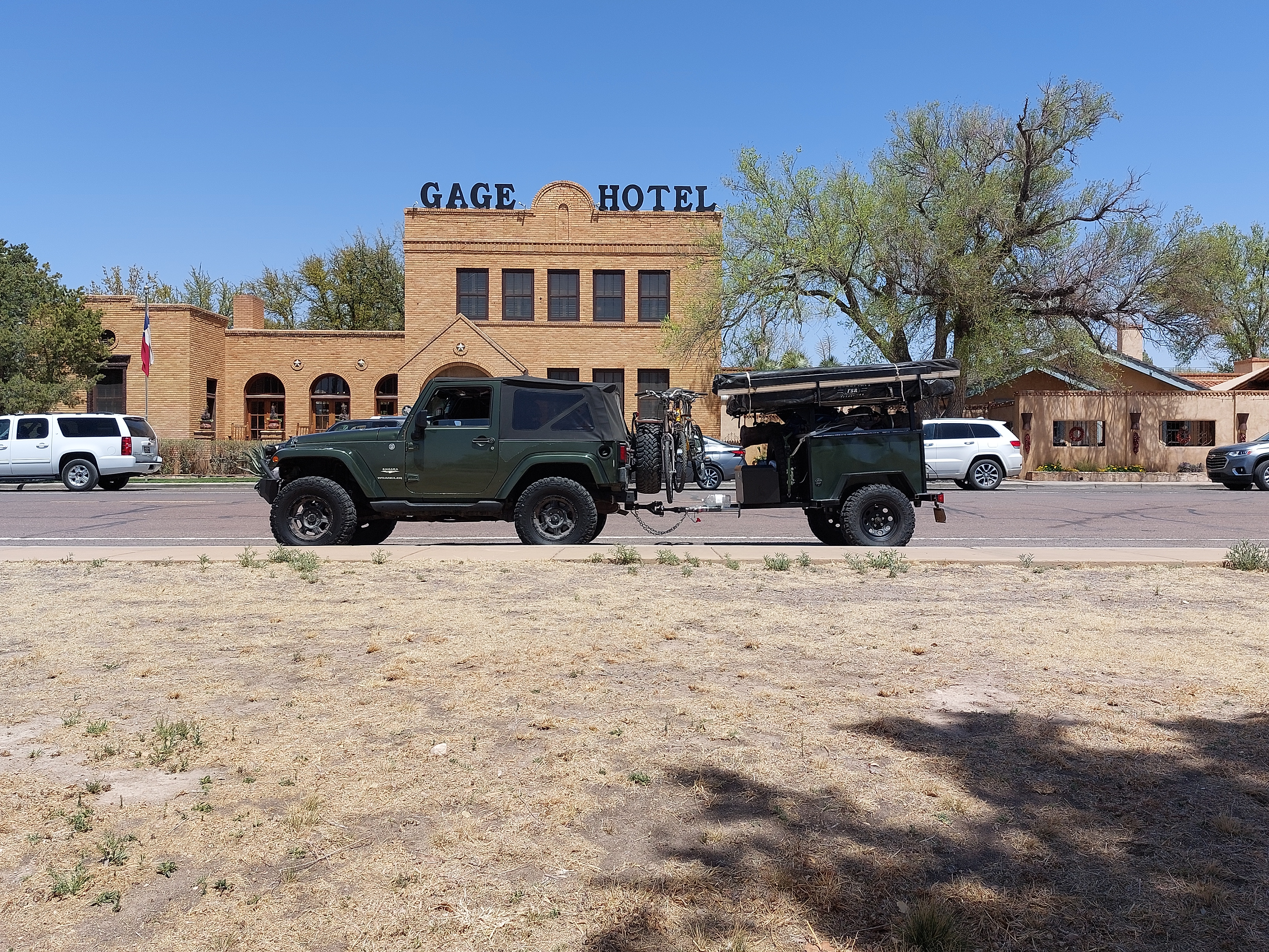 Lightweight camping trailer at a Texas campsite